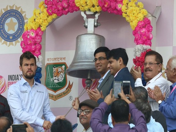 Viswanathan Anand and Magnus Carlsen ringing the bell at Eden Gardens on day two (Photo/ BCCI Twitter)