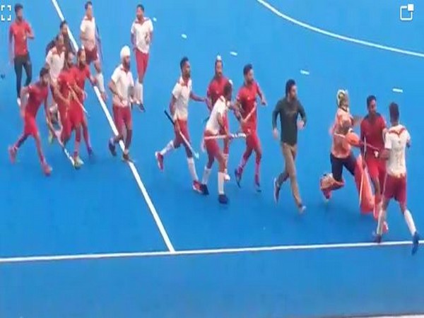 Players of Punjab Police and Punjab National Bank fighting in the 56th Nehru Senior Hockey Tournament final. 