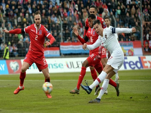 Players struggling for ball during Portugal-Luxembourg clash. 