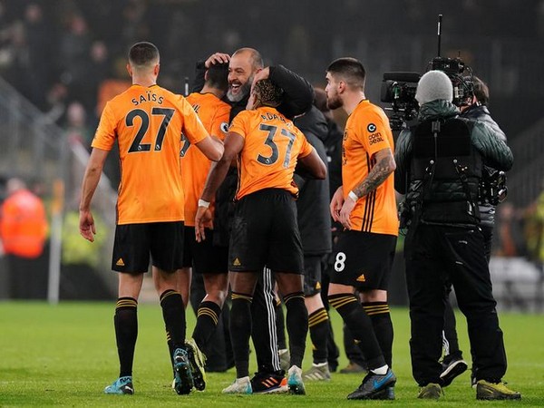  Wolves'  manager Nuno Espirito Santo celebrates with his players after the match