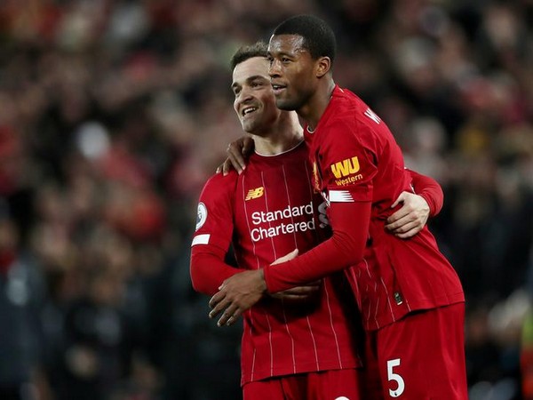 Liverpool's Georginio Wijnaldum celebrates with Xherdan Shaqiri