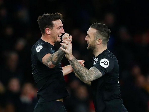 Brighton's Lewis Dunk and Shane Duffy celebrate after the match