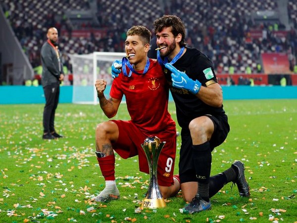 Liverpool's Roberto Firmino and Alisson celebrate Club World Cup win on Saturday