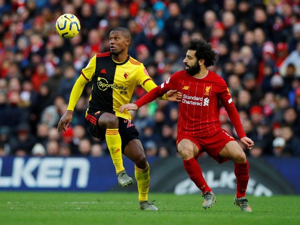 Watford's Christian Kabasele in action with Liverpool's Mohamed Salah.