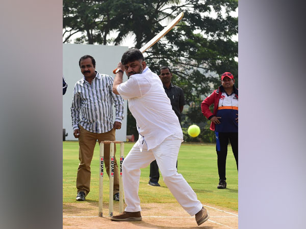 Congress leader DK Shivakumar while playing a cricket shot. 