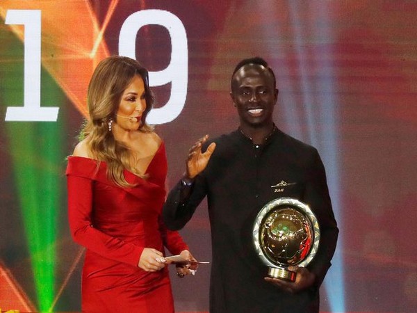 Sadio Mane with the African player of the year 2019 trophy at CAF Awards. 