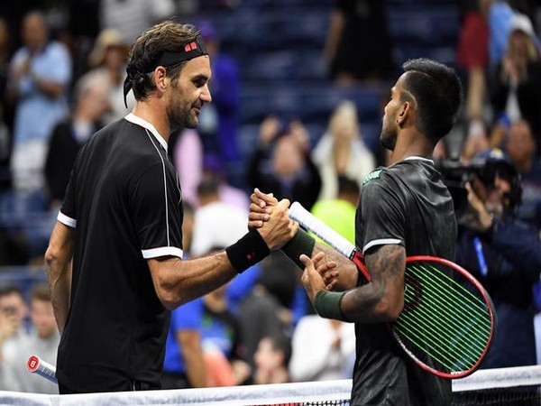 Roger Federer shaking hands with Sumit Nagal after the first round match of US Open.