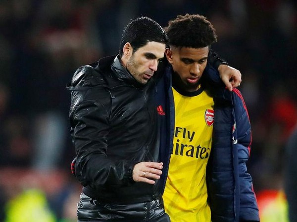 Arsenal manager Mikel Arteta with Reiss Nelson