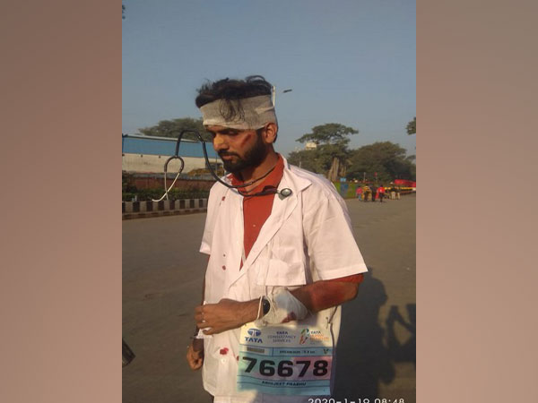 A participant dressed up as a beaten-up doctor during Mumbai Marathon. 