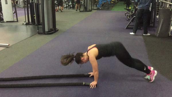 Double arm wave with a burpee